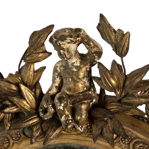 547 - 19th-century gilt framed oval mirror the top adorned with a cherub among wreaths, egg and rose motif... 