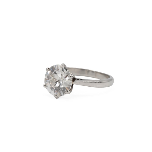 1 - A diamond solitaire ring, the old European cut weighing approximately 3.20 carats, in a six-claw set... 