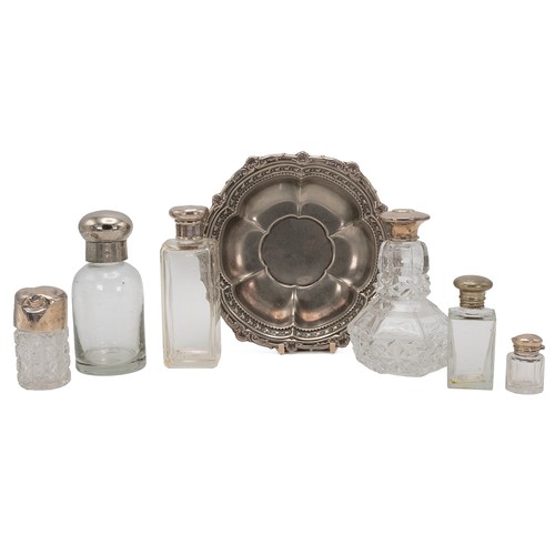 24 - A collection of four silver-topped scent bottles, along with two other plated examples and silver pl... 