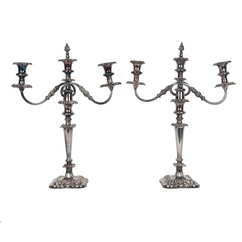 26 - Pair of tall Sheffield plate candelabra, mid 19th Century. Neoclassical form, removable drip trays a... 