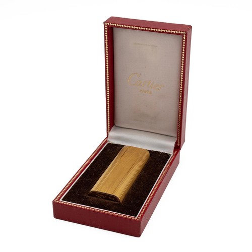 29 - Cartier gold plated engine turned pocket lighter, No 63994 A, in original fitted box.