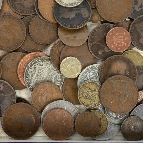 35 - A large collection of world coins and banknotes, including some silver examples.