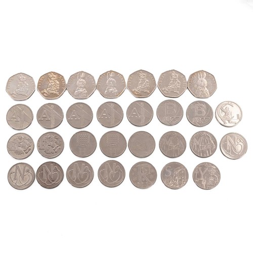 39 - Group of commemorative 10p coins, including Stonehenge, along with various 50p coins and silver Conc... 