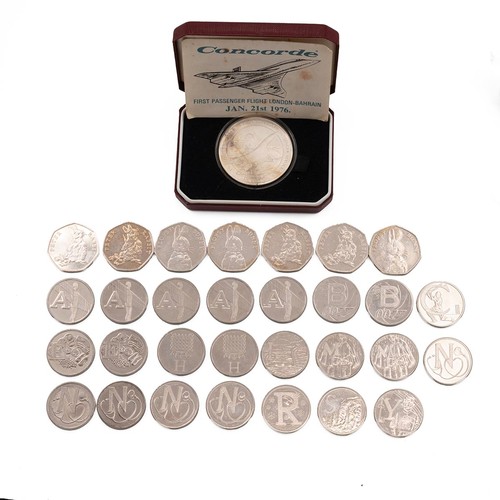 39 - Group of commemorative 10p coins, including Stonehenge, along with various 50p coins and silver Conc... 