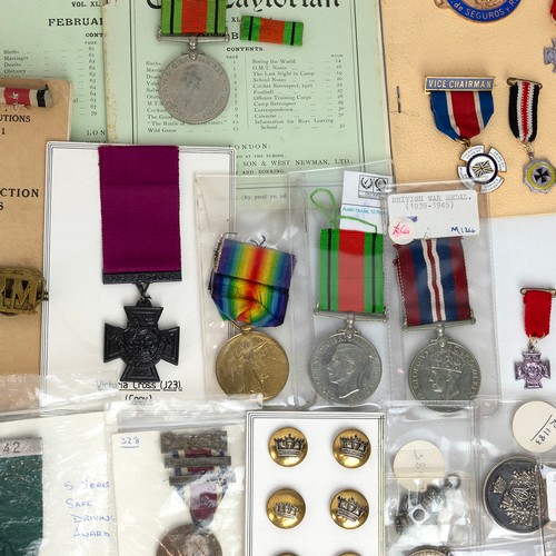 58 - Military group - cap badges, buttons, medals, books, ephemera and WW2 rucksack.