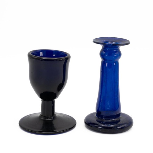 125 - Blue glass to include a small goblet with snapped pontil, the base broader than the cup (H 11cm), to... 