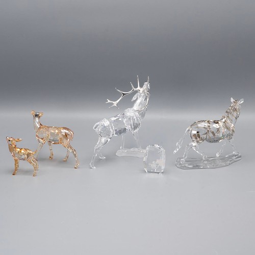 126 - Collection of four SWAROVSKI crystal animals and a plaque. To include a horse, stag and two deer all... 