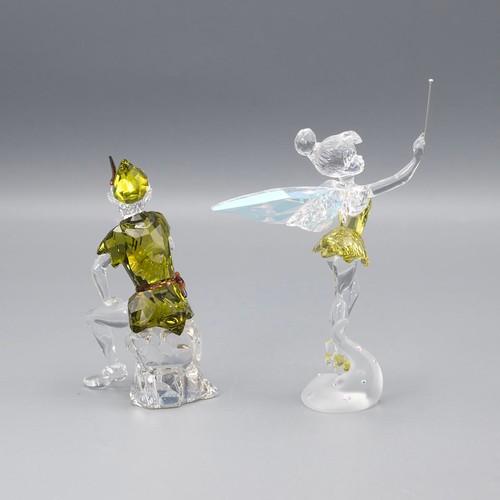 130 - Swarovski crystal Peter Pan and Tinkerbell, both in original boxes.