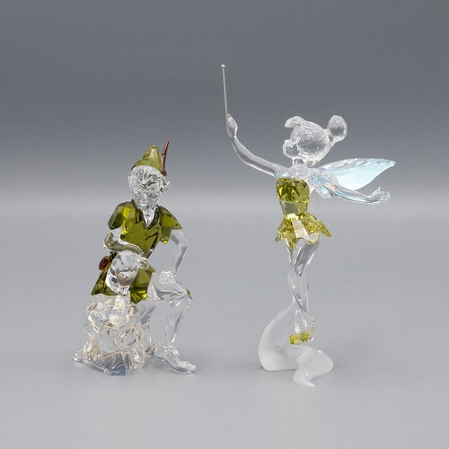 130 - Swarovski crystal Peter Pan and Tinkerbell, both in original boxes.