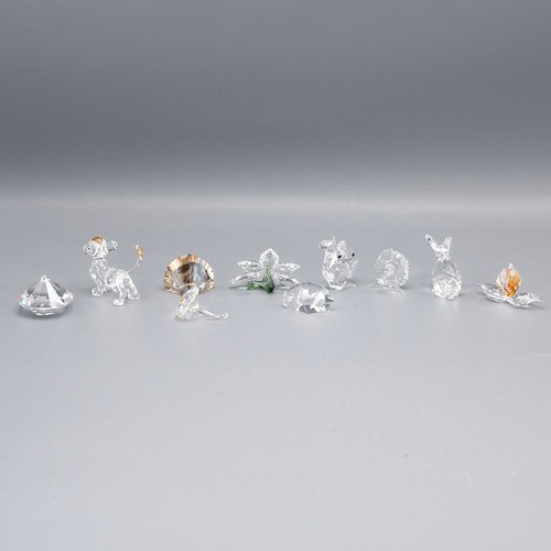 131 - Collection of Swarovski crystal, including flowers, rabbit, squirrel, lion cub etc. all in original ... 