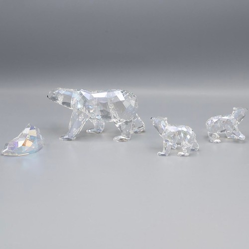 134 - Swarovski Crystal Society 'Siku Polar Bear' with certificate and two polar bear cubs, in original bo... 