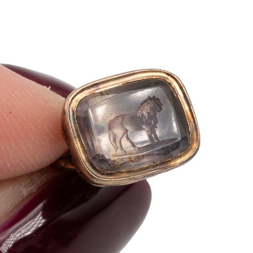 247 - Miniature yellow metal fob watch seal with crystal intaglio engraved with a horse.