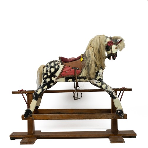 287 - 20th century pine rocking horse, painted in black and white throughout with horse hair tail and mane... 