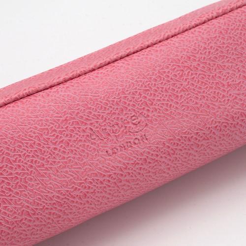 390 - Asprey of London: a pink leather make up case with zip. 18cm x 4.5cm x 4cm.