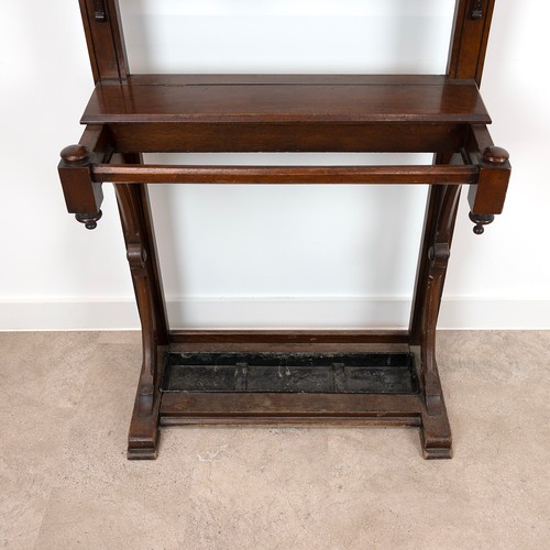 446 - 20th Century mahogany hall stand, with a metal drip try, bevelled mirror, six hanging hooks each wit... 