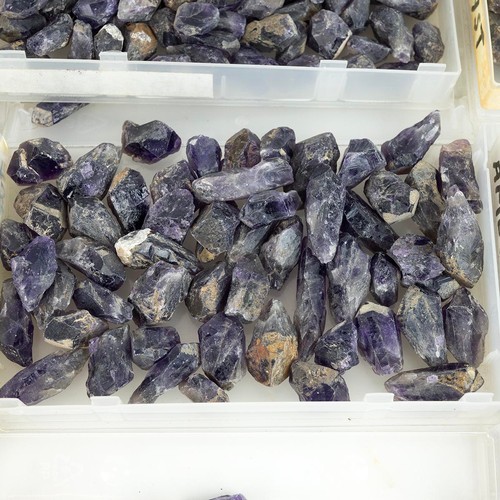 194 - Collection of rough, uncut, polished gemstones, mostly amethyst, tourmaline and others.