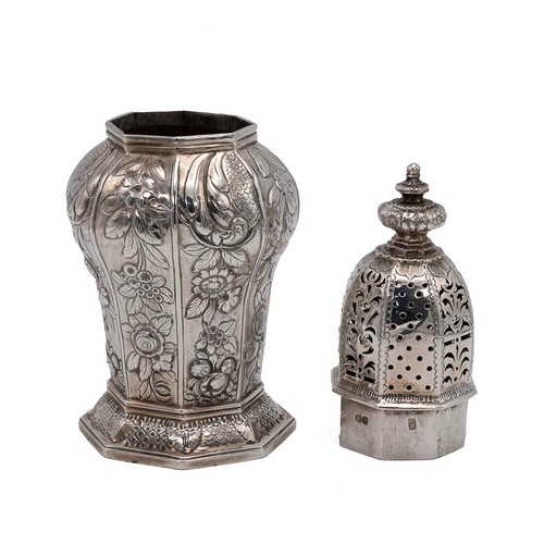 305 - A finely detailed Georgian silver sugar sifter, of baluster form, raised on an octagonal stepped bas... 