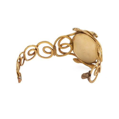 489 - An 18ct gold (tested) bangle, of intricate detail in the form of two entwined serpents, bearing an o... 