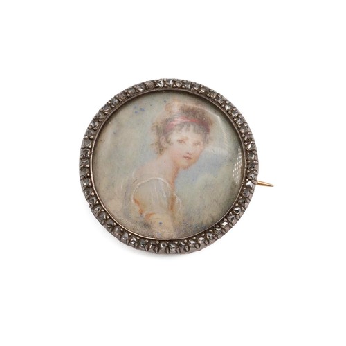 490 - An 18ct gold backed (tested) circular brooch depicting  miniature portrait of a young lady on ivory ... 