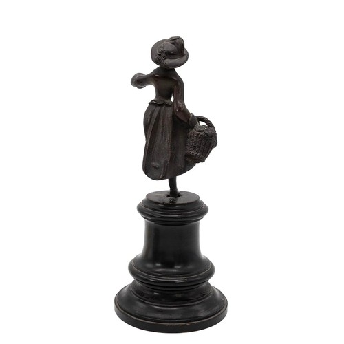 24 - Small bronze statue of a flower seller, on ebonised base, unsigned, c1900. Also a silver circular ph... 