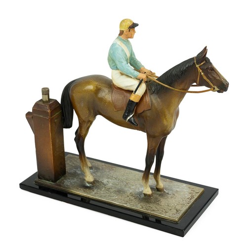 28 - An Art Deco style cold painted spelter table lighter modelled as a jockey mounted on a racehorse. H ... 