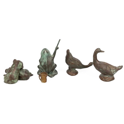 31 - A collection of bronze figures to include: two pigs, one resting its head on the other recumbent; tw... 