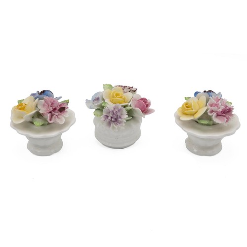 67 - Collection of 7 Royal Doulton rose posies of varying sizes and forms, the tallest 13cm. (7)