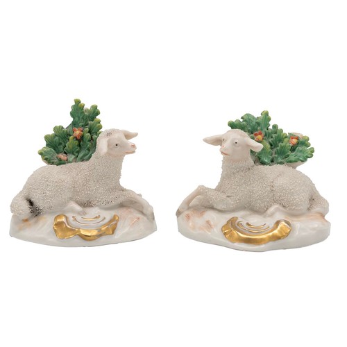 88 - Pair of 19th century Chelsea figurines of lambs in repose with brocage backgrounds and parcel gilt b... 