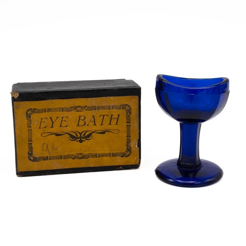 186 - A Bristol blue glass eye bath, Simmons Improved Sovereign balance scales, 'The Alert Wrist Watch', a... 