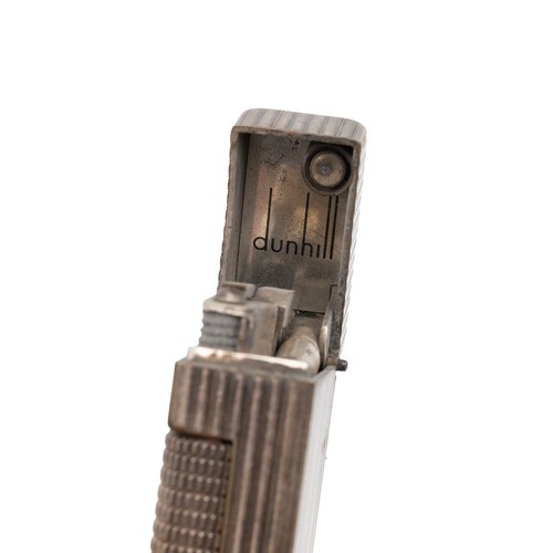 23 - A vintage Dunhill Rollagas silver plated lighter, with ribbed body, reg no. 24163 length 6.5cm, unbo... 