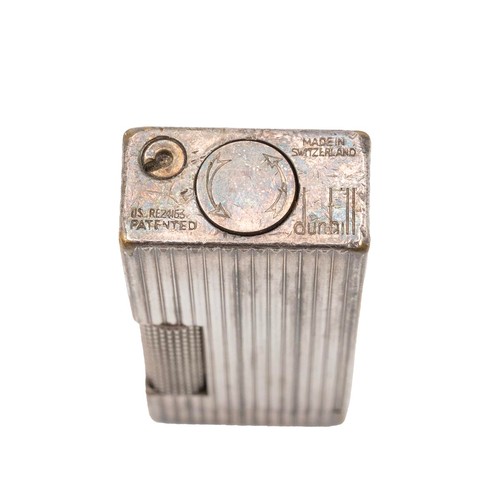 23 - A vintage Dunhill Rollagas silver plated lighter, with ribbed body, reg no. 24163 length 6.5cm, unbo... 