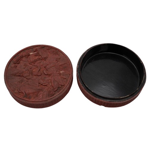 244 - A Chinese circular cinnabar box with pictorial scene to the lid depicting two figures with mountains... 