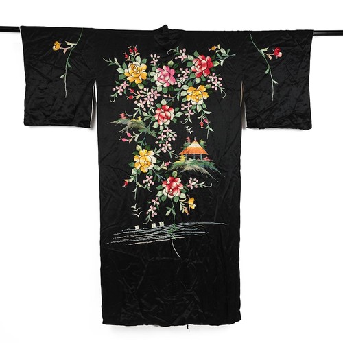 248 - A Chinese embroidered dressing gown with printed silk lining decorated with garlands of flowers the ... 