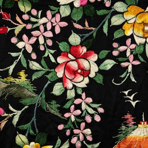 248 - A Chinese embroidered dressing gown with printed silk lining decorated with garlands of flowers the ... 