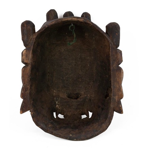 257 - Tibetan Buddhist Mahakala mask. Carved wood, W 30cm, H 42cm.