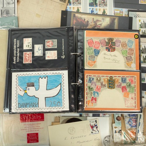 300 - A large collection of modern stamps, including presentation packs, first days, albums and others.