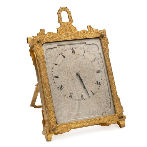 388 - An engraved Victorian cased easel clock in the  manner of Thomas Cole. The silvered and engraved dia... 