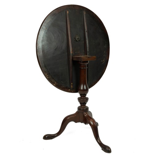 409 - Mahogany tilt top table, early 19th Century. Tripod base with turned baluster support. Diameter top ... 