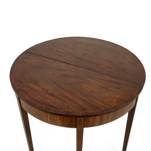 417 - Mahogany demi lune fold-over table, c1900. String inlay detailing, swinging back leg. Diameter 91cm,... 