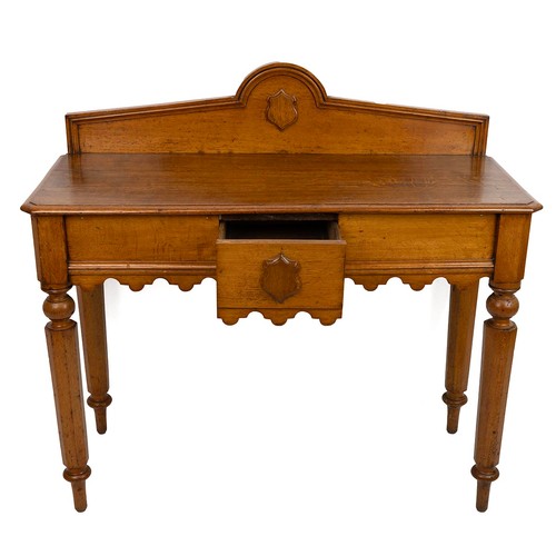 423 - 19th century oak hall table, with gallery back and applied shield, the top with chamfered corners an... 