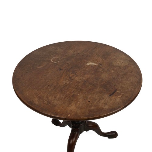 424 - Georgian mahogany circular tilt top table, raised on a turned baluster column to cabriole supports t... 