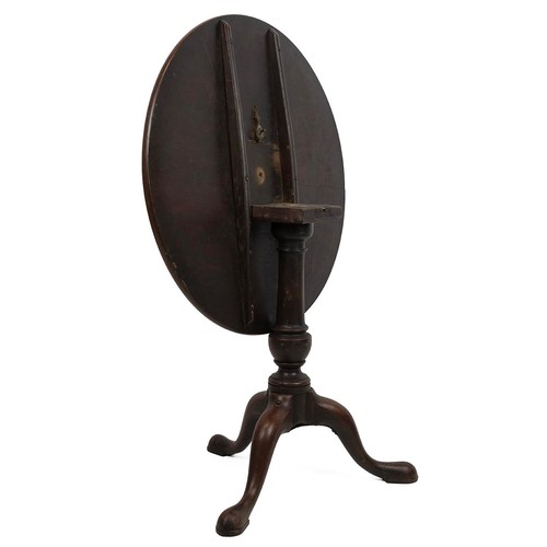 424 - Georgian mahogany circular tilt top table, raised on a turned baluster column to cabriole supports t... 