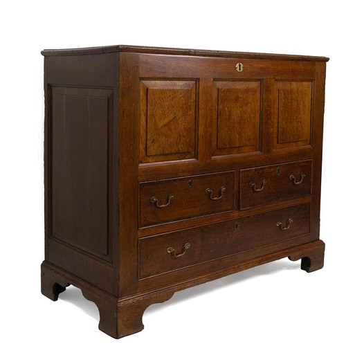 426 - George III oak mule chest. Three drawers with box above. Lid opens to reveal candle box with one rea... 