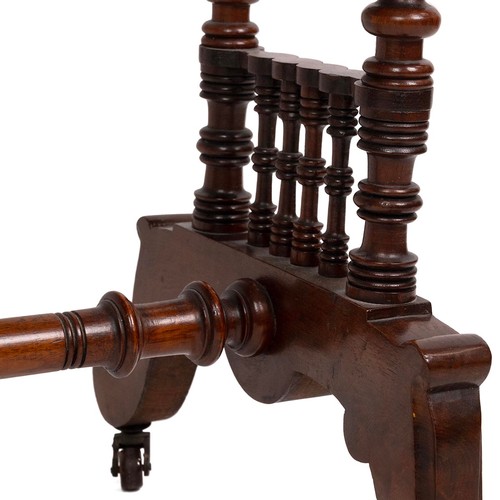 427 - Mahogany hall table, late Victorian. Turned supports and spindle decoration, shaped legs with castor... 