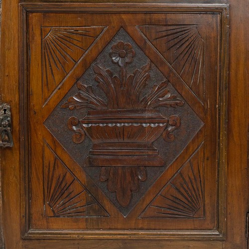 436 - Carved secretaire bookcase, late 19th Century. Walnut body with glazed and leaded upper doors, cupbo... 