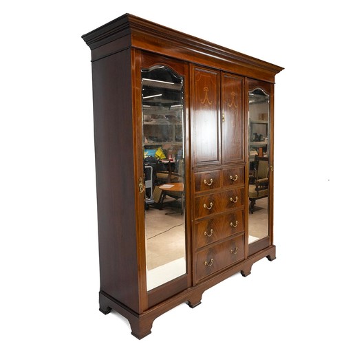 437 - Edwardian inlaid Sheraton Revival Style Mahogany triple wardrobe. The central section of two doors i... 