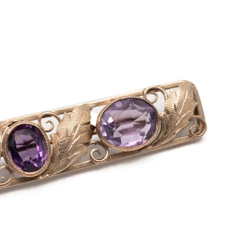 164 - Fine 9ct gold (tested) three stone amethyst brooch, decorated with acanthus leaves in a pierced sett... 
