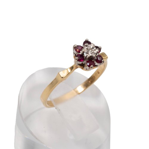 3 - An 18ct gold diamond and garnet set ring in a flower head and open setting, 2.5 grams, size O.