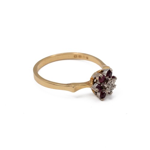 3 - An 18ct gold diamond and garnet set ring in a flower head and open setting, 2.5 grams, size O.