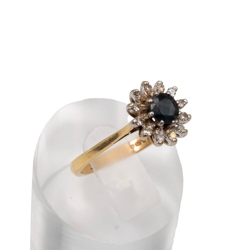 4 - An 18ct gold diamond and sapphire cluster ring in an open claw setting, 3.2 grams, size N 1/2.